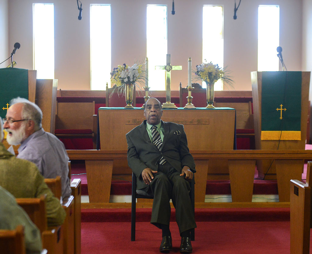 Reverend Leon Steward welcomes participants to Russell Chapel